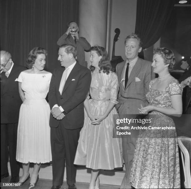 American actress Betsy Blair portrayed in a group shot with Nadia Gray, Jules Dassin and Jhonson Van, Cannes, 1950.