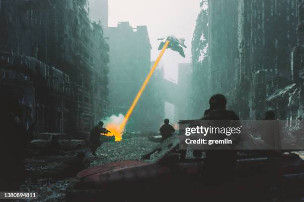 ufo shooting at soldiers in destroyed city - alien laser beam stock pictures, royalty-free photos & images