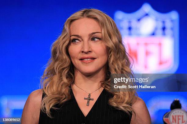 Singer Madonna looks on during a press conference for the Bridgestone Super Bowl XLVI halftime show at the Super Bowl XLVI Media Center in the J.W....