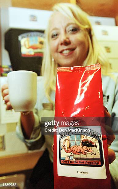 Urban Fare store manager Leanne Ring displays a package of Kopi Luwak coffee September 12, 2002 in Vancouver, Canada. The world's rarest and most...