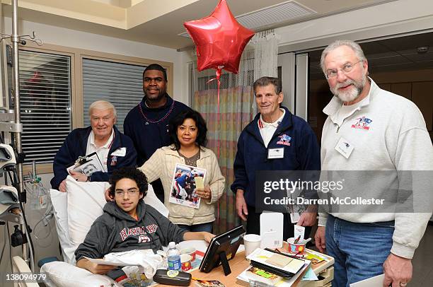 Tom Yewcic, Ed Ellis, Bob Cappadona, and Pete Brock visit with Nicholas and mom during the New England Patriots Alumni Visit Children's Hospital...