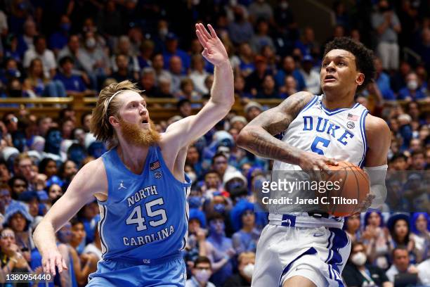 Brady Manek of the North Carolina Tar Heels guards Paolo Banchero of the Duke Blue Devils during the second half at Cameron Indoor Stadium on March...