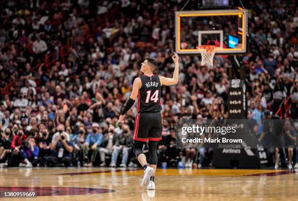 Tyler Herro of the Miami Heat gestures for a three point shot against the Philadelphia 76ers in the second half at FTX Arena on March 05, 2022 in...
