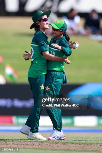 Diana Baig and Bismah Maroof of Pakistan celebrate after taking the wicket of Mithali Raj of India during the 2022 ICC Women's Cricket World Cup...