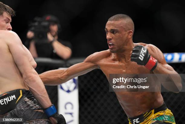 Edson Barboza of Brazil punches Bryce Mitchell in their featherweight fight during the UFC 272 event on March 05, 2022 in Las Vegas, Nevada.