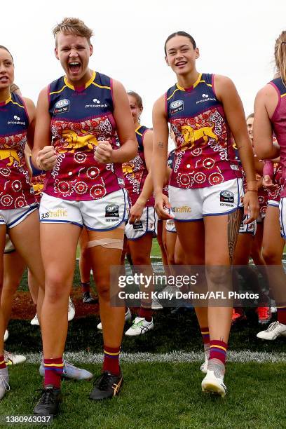 Dakota Davidson of the Lions and Jesse Wardlaw of the Lions celebrate the win during the round nine AFLW match between the Brisbane Lions and the...