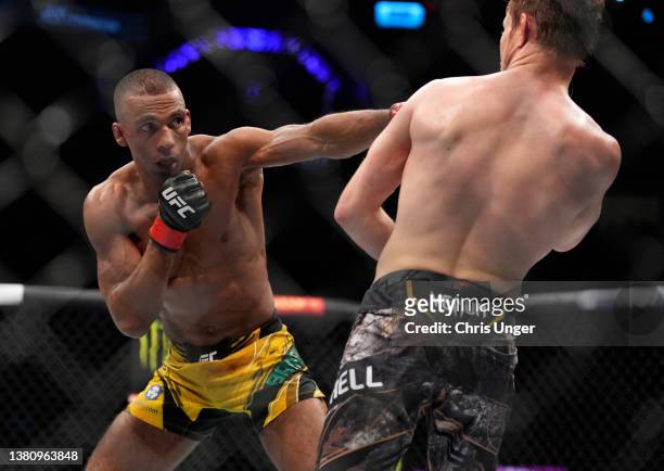 Edson Barboza of Brazil punches Bryce Mitchell in their featherweight fight during the UFC 272 event on March 05, 2022 in Las Vegas, Nevada.