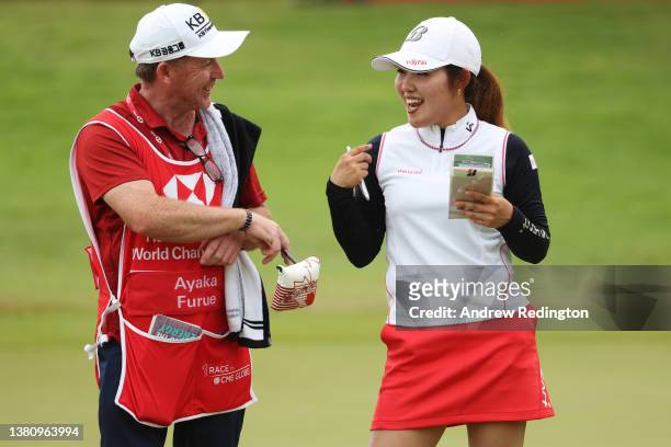 Ayaka Furue of Japan talks with her caddie on the eighteenth hole during the Final Round of the HSBC Women's World Championship at Sentosa Golf Club...