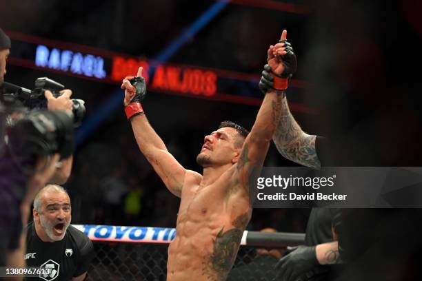 Rafael Dos Anjos of Brazil celebrates his win over Rafael Fiziev of Kazakhstan in their lightweight fight during UFC 272 at T-Mobile Arena on March...