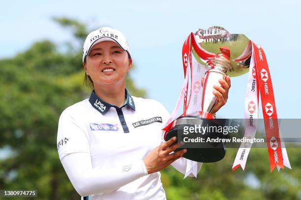 Jin Young Ko of South Korea celebrates with the HSBC Women's World Championship trophy after winning during the Final Round of the HSBC Women's World...
