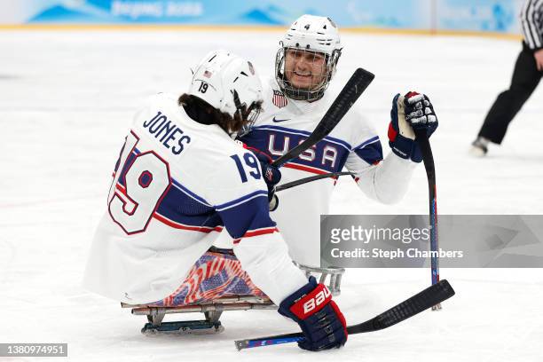 Malik Jones and Brody Roybal of Team United States celebrate after a goal in the second period during the Group A preliminary round Para Ice Hockey...