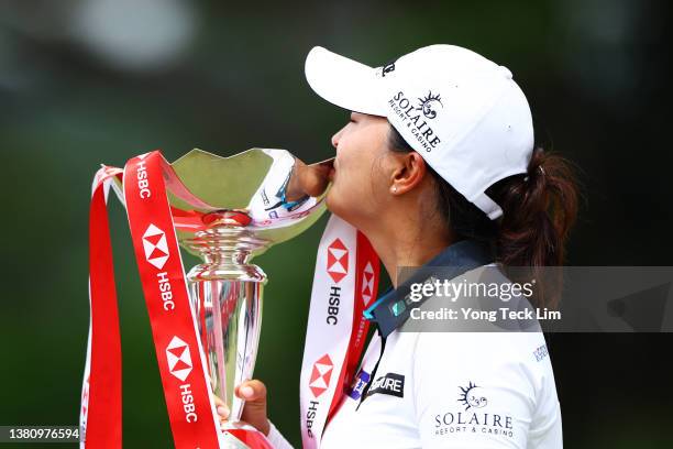 Jin Young Ko of South Korea celebrates with the HSBC Women's World Championship trophy after winning during the Final Round of the HSBC Women's World...