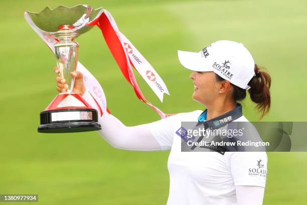 Jin Young Ko of South Korea poses with the HSBC Women's World Championship trophy as she celebrates after winning during the Final Round of the HSBC...