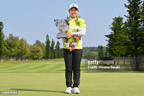 Mao Saigo of Japan poses with the trophy after winning the tournament following the final round of the Daikin Orchid Ladies at Ryukyu Golf Club on...
