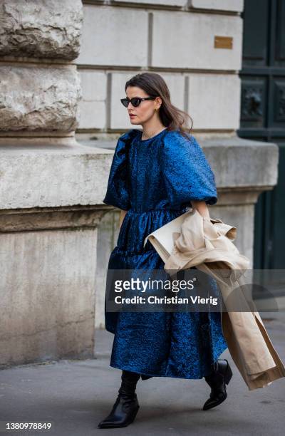Guest is seen wearing blue dress outside Hermes during Paris Fashion Week - Womenswear F/W 2022-2023 on March 05, 2022 in Paris, France.