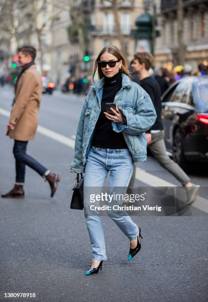 Pernille Teisbaek seen wearing denim jacket, jeans, black bag, turtleneck, heels outside Hermes during Paris Fashion Week - Womenswear F/W 2022-2023...