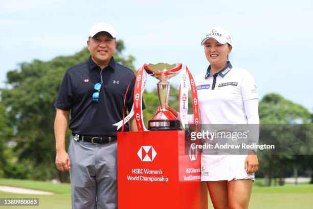 Jin Young Ko of South Korea poses with Wong Kee Joo, CEO of HSBC Singapore and the HSBC Women's World Championship trophy as she celebrates after...