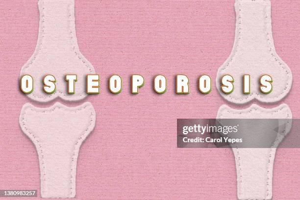 osteoporosis conceptual image in pink background - osteoporose stock-fotos und bilder