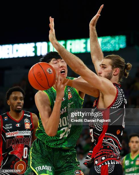 Zhou Qi of the Phoenix and Sam Froling of the Hawks contest the ball during the round 16 NBL match between South East Melbourne Phoenix and Illawarra...