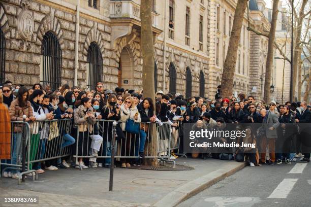 Crowd of fans and photographers wait outside at the Hermes show at Gendarmerie Nationale-Garde Républicaine during Paris Fashion Week Fall/Winter...