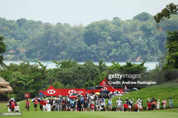 The final group of In Gee Chun of South Korea, Jeongeun Lee6 of South Korea and Jin Young Ko of South Korea walk down the eighteenth fairway during...