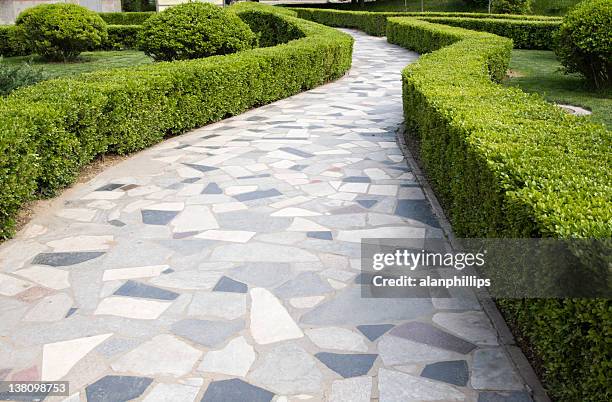 crazy paving path winding between hedges in a beijing park - paving stone stock pictures, royalty-free photos & images