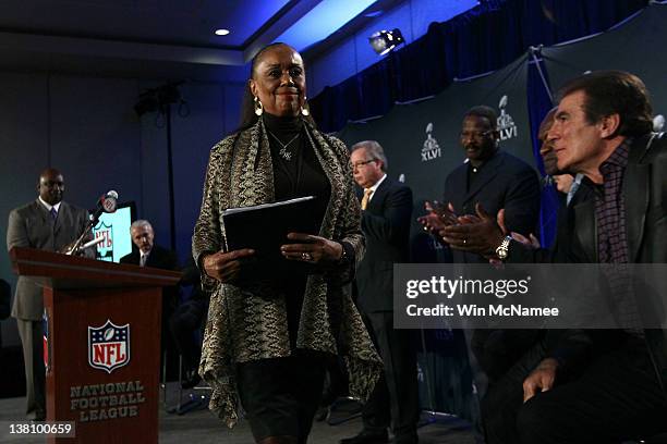 Sylvia Mackey walks away from the podium after speaking during a press conference held by the NFL Alumni Association at the Super Bowl XLVI Media...