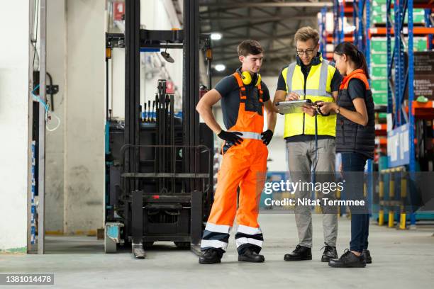warehouse cost saving ideas and warehouse strategy. warehouse teams making decision or brainstorms to finding the right level of automation and systems for a customer satisfaction in a distribution warehouse. - employee safety stock pictures, royalty-free photos & images