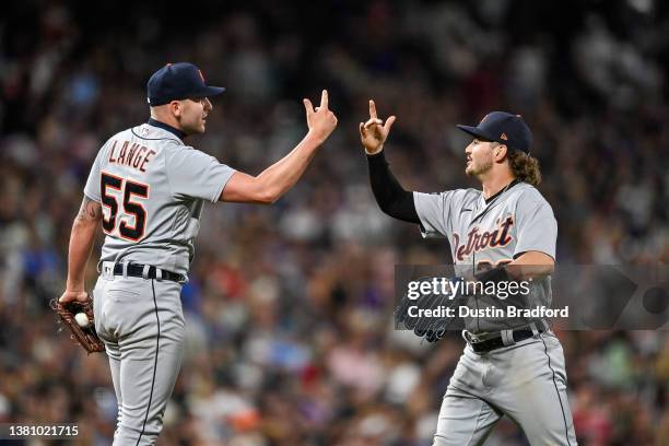 Alex Lange of the Detroit Tigers celebrates with Zach McKinstry after a 10th inning win against the Colorado Rockies at Coors Field on July 1, 2023...