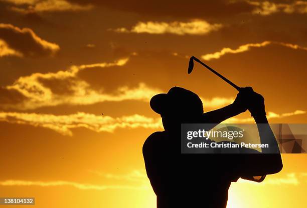 Pat Perez hits his second shot on the ninth hole during the first round of the Waste Management Phoenix Open at TPC Scottsdale on February 2, 2012 in...