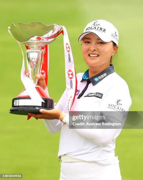 Jin Young Ko of South Korea poses with the HSBC Women's World Championship trophy as she celebrates after winning during the Final Round of the HSBC...