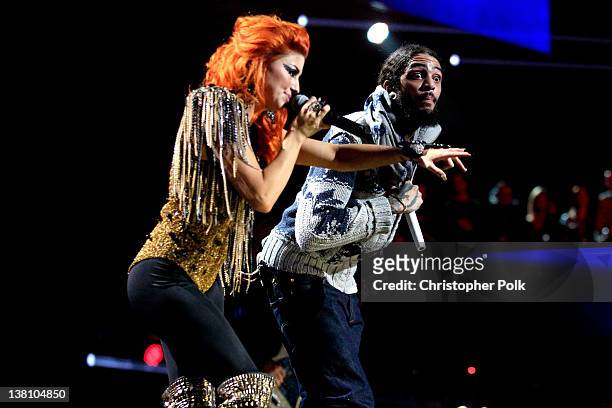 Singer Travie McCoy of Gym Class Heroes and Singer Neon Hitch perform onstage during VH1's Super Bowl Fan Jam at Indiana State Fairgrounds, Pepsi...