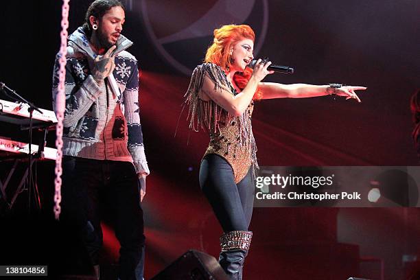 Singer Travie McCoy of Gym Class Heroes and Singer Neon Hitch perform onstage during VH1's Super Bowl Fan Jam at Indiana State Fairgrounds, Pepsi...