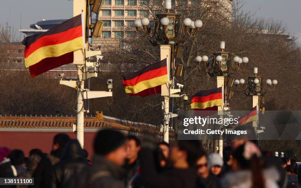 Chinese and German flags flutter in front of Tiananmen Rostrum on February 2, 2012 in Beijing, China. German Chancellor Angela Merkel will pay an...