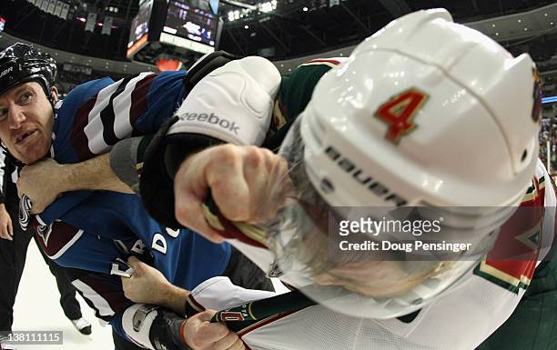 Cody McLeod of the Colorado Avalanche and Clayton Stoner of the Minnesota Wild engage in a fight in the second quarter at the Pepsi Center on...