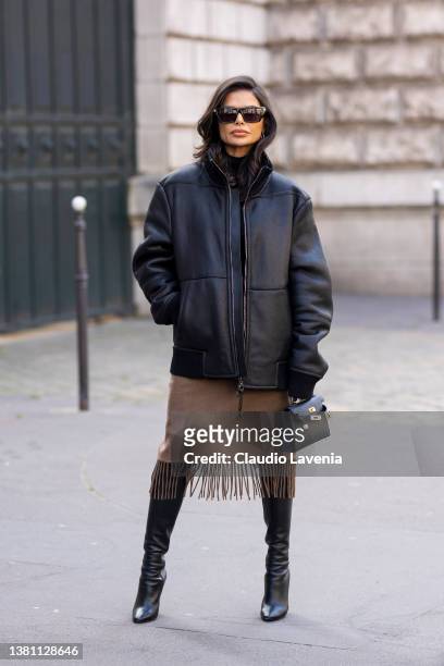 Victoria Barbara wearing a black leather bomber jacket, brown fringed skirt, black Hermes bag and black boots, is seen outside Hermes, during Paris...
