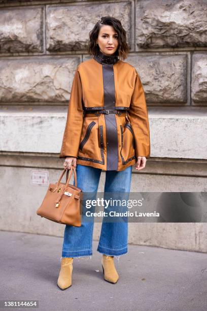 Alexandra Pereira wearing a camel jacket with brown leather details, blue jeans, camel Hermes bag and bege boots, is seen outside Hermes, during...