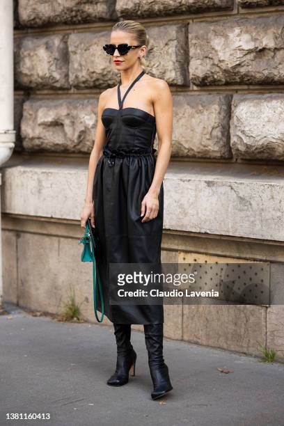 Caroline Daur wearing a black leather midi dress, black boots and green Hermes bag, is seen outside Hermes, during Paris Fashion Week - Womenswear...