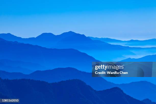 view of blue mountains in the fog. central mountains taiwan - taiwan landscape stock pictures, royalty-free photos & images