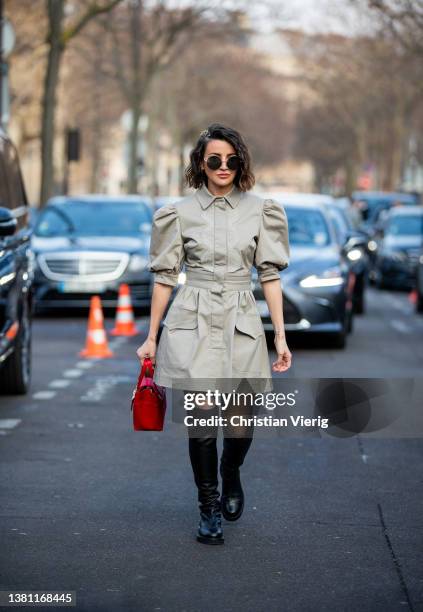 Alexandra Pereira seen wearing red bag, beige dress, black over knees boots outside Elie Saab during Paris Fashion Week - Womenswear F/W 2022-2023 on...