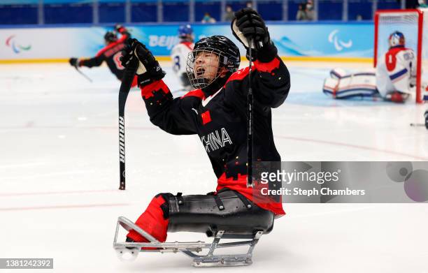 Yifeng Shen of Team China celebrates after scoring their first goal in the second period in the game against Czech Republic during the Group B...