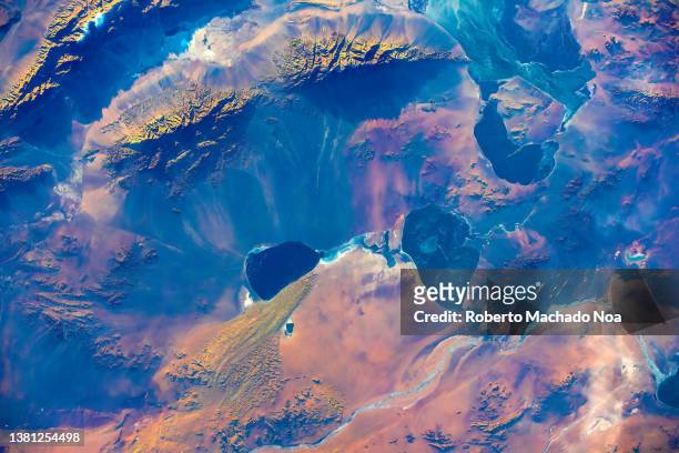 land feature in orange and blue - satellite view fotografías e imágenes de stock