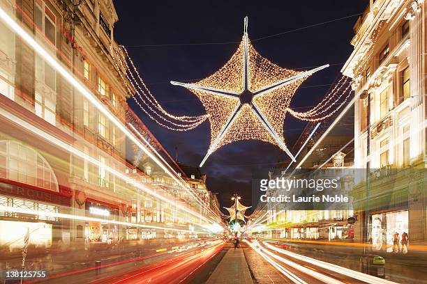 christmas decorations in oxford street; london - oxford street christmas stock pictures, royalty-free photos & images