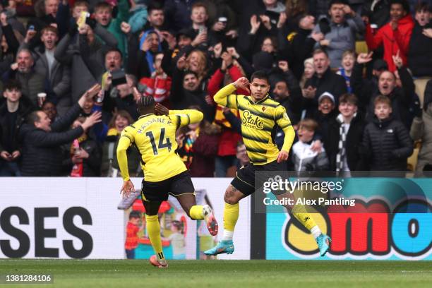 Cucho Hernandez of Watford FC celebrates with team mate Hassane Kamara after scoring their sides first goal during the Premier League match between...