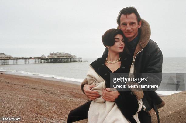 Actress Laura San Giacomo on Brighton beach with Liam Neeson in a publicity still for the thriller 'Under Suspicion', 1991.