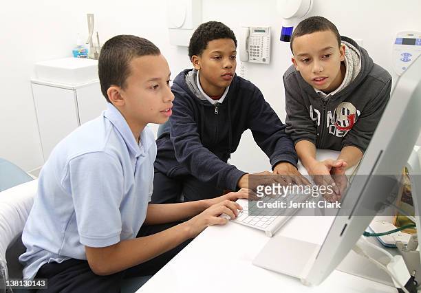Students of Urban Promise play online video games during Celebrities For Smiles hosted by Kris Humphries at Smile Design Manhattan on February 2,...