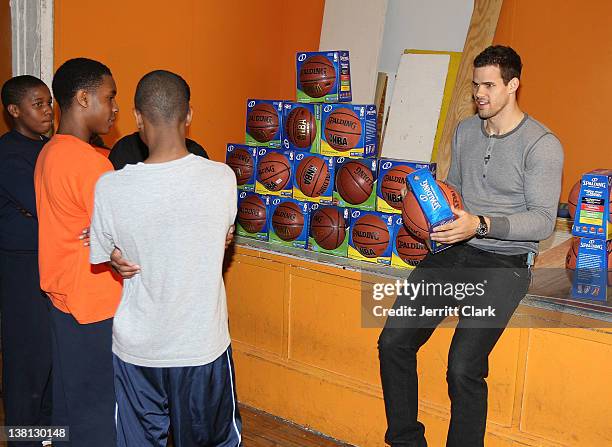 Kris Humphries autographs basketballs at Urban Promise after surprising 12 youth with a trip to NYC for free dental work by Smile Design Manhattan on...