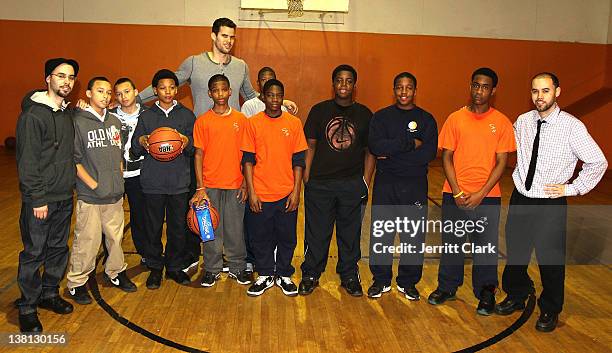 Kris Humphries poses with youth at Urban Promise after surprising them with a trip to NYC for free dental work by Smile Design Manhattan on February...