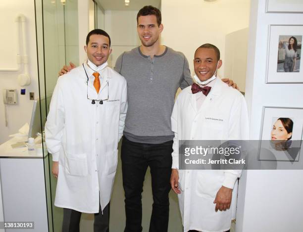Kris Humphries poses with Alexandre Gause DDS and Lee Gause DDS of Smile Design Manhattan during Celebrities For Smiles hosted by Kris Humphries at...