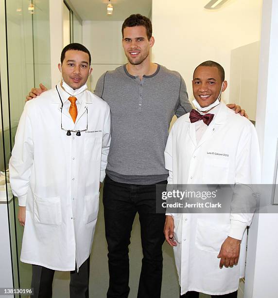 Kris Humphries poses with Alexandre Gause DDS and Lee Gause DDS of Smile Design Manhattan during Celebrities For Smiles hosted by Kris Humphries at...